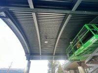 This image highlights the underside of the awning which was repainted in a forest green color, making the awning look brand new again.